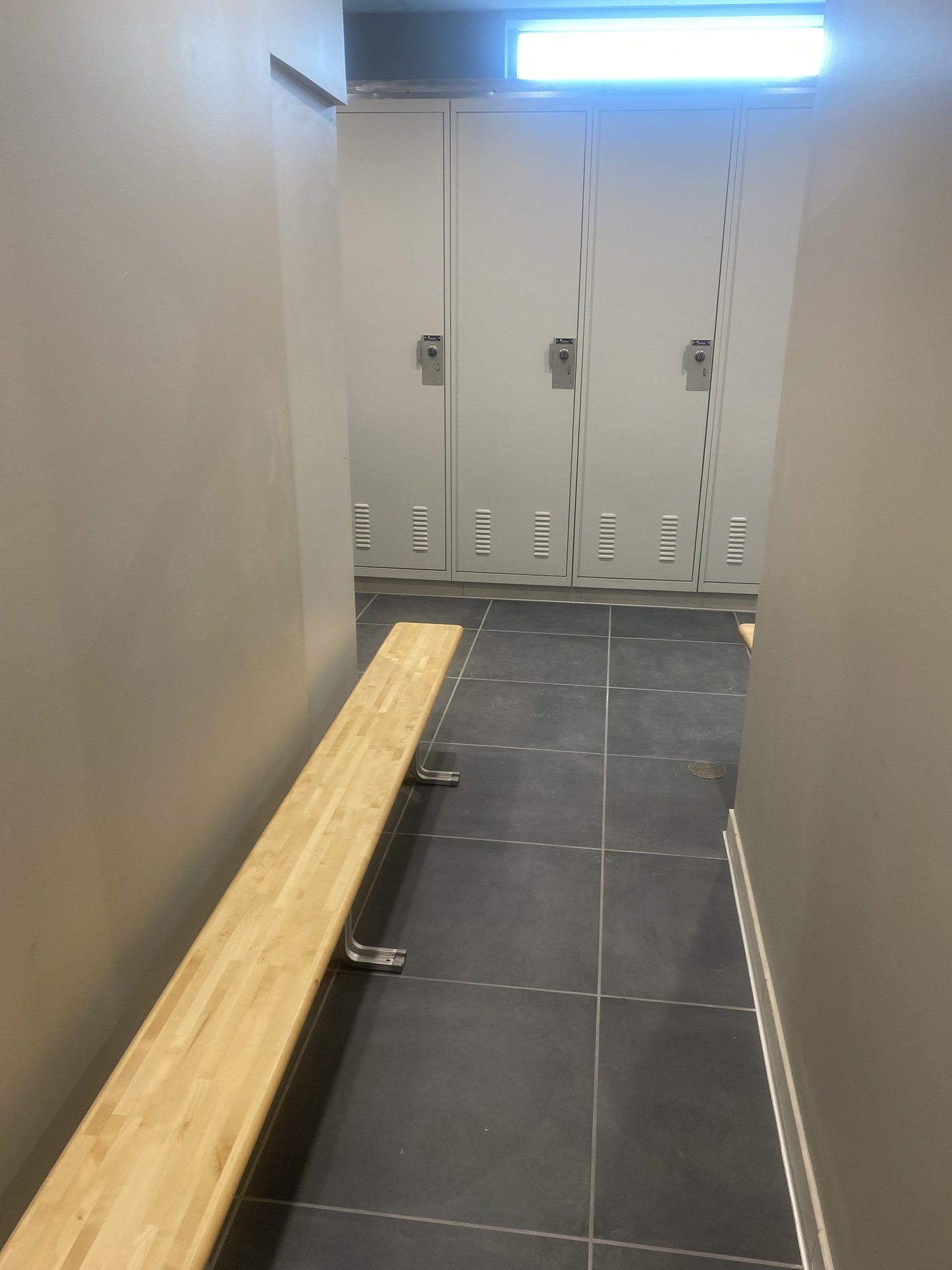 Locker room with custom bench